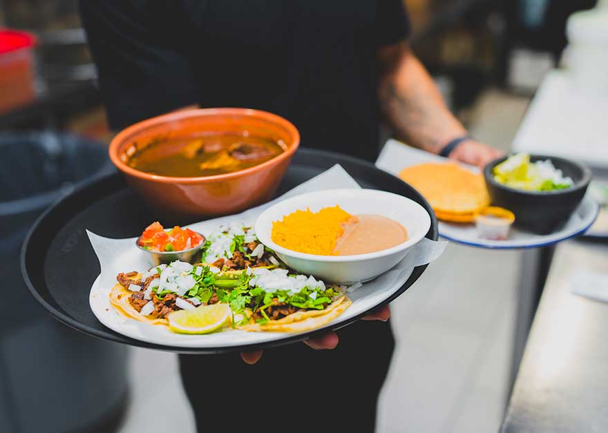 La-Marqueza-27-server-bringing-several-dishes La-Marqueza-27-server-bringing-several-dishes