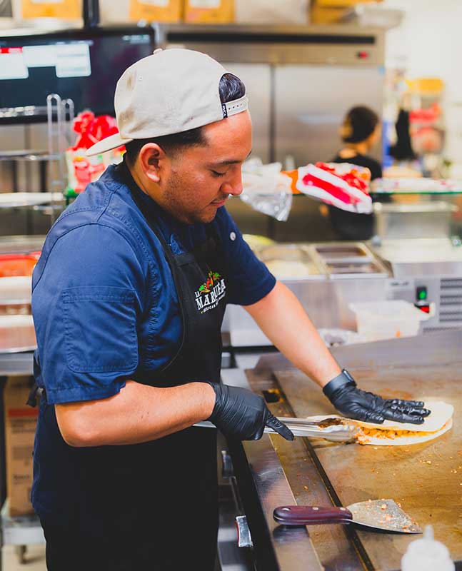 La-Marqueza-29-chef-making-quesadillas La-Marqueza-29-chef-making-quesadillas