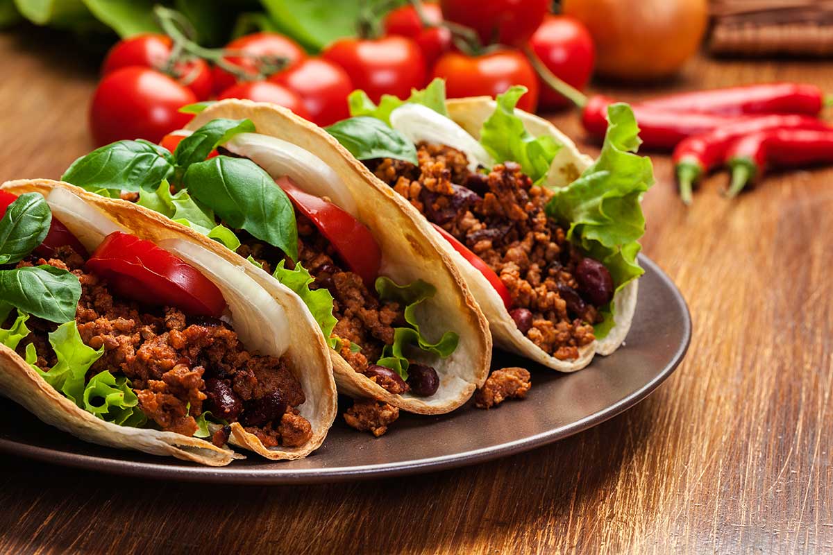 tacos with veggies and mince on a plate tacos with veggies and mince on a plate
